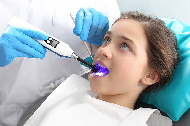child in the dental chair dental treatment during surgery